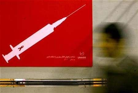 A man walks past a poster at a conceptual art exhibition about HIV/AIDS. Reuters Files