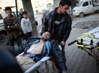 free-syrian-army-fighters-carry-their-wounded-comrade-who-was-shot-during-a-fight-reuters-file