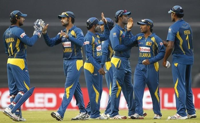 Sri Lanka players give each other a pat on the back after restricting Bangladesh to a small total in their Asia Cup 2014 match, 6 March. Reuters Sri Lanka