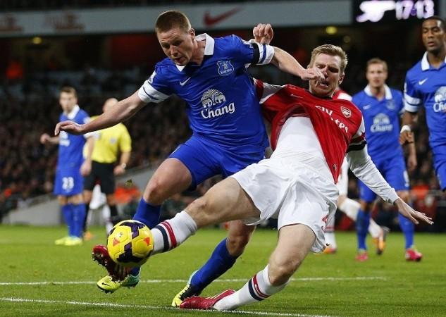 Everton midfielder James McCarthy and Arsenal defender Per Mertesacker battle for possession in their English Premier League game, 8 December. Reuters McCarthy Everton Mertesacker Arsenal