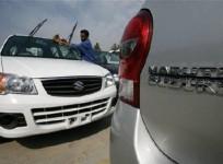 a-worker-cleans-a-parked-car-at-the-maruti-suzuki039s-stockyard-on-the-outskirts-of-jammu-october-30-2010