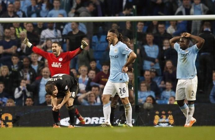 Two sides of the coin after Wigan's big FA Cup quarterfinal win over Manchester City, 9 March. Reuters Manchester City Wigan Demichelis Richards McArthur Carson