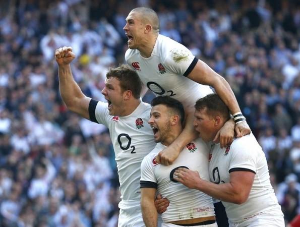 England players celebrate a try against Wales during their Six Nations match, 9 March. Reuters England rugby
