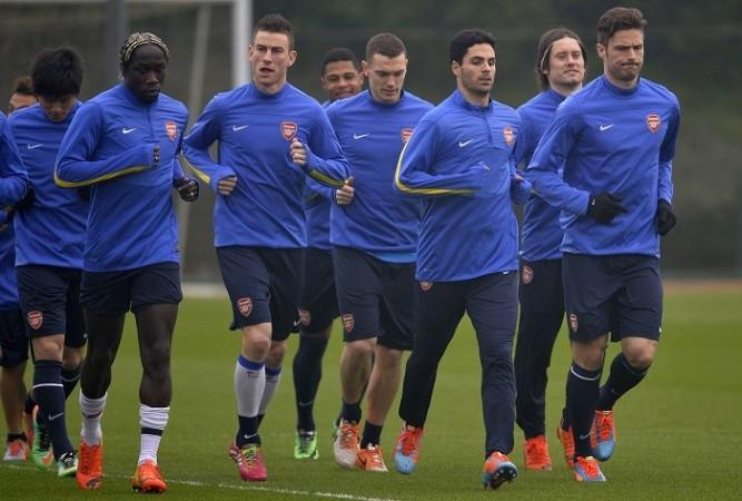 Arsenal will look to up their game against Tottenham in the North London Derby. Reuters Arsenal Giroud Sagna Koscielny Arteta Vermaelen