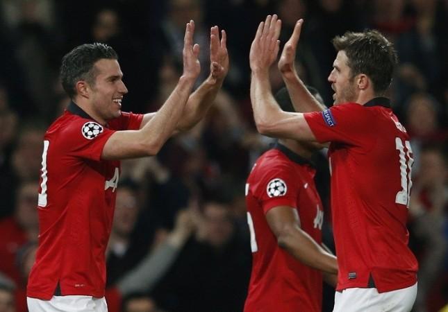 Manchester United striker Robin Van Persie celebrates with Michael Carrick after scoring against Olympiakos in the Champions League, 19 March. Reuters Robin Van Persie Michael Carrick Manchester United