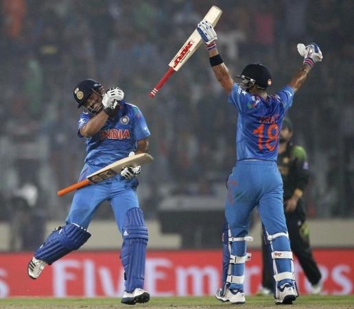 Suresh Raina and Virat Kohli celebrate their win over Pakistan in their World T20 game, 21 March. Reuters Suresh Raina Virat Kohli India