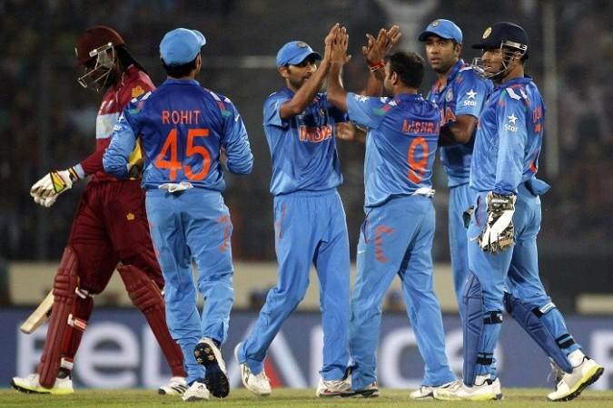 India celebrate the wicket of Chris Gayle, 23 March. Reuters India Mishra Gayle