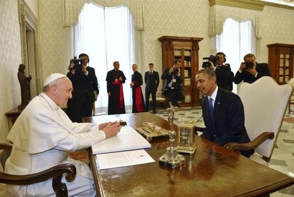 US President Barack Obama (R) talks with Pope Francis during a private audience at the Vatican City March 27.