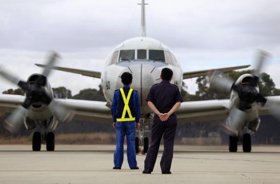Aircraft technicians from the Japan Maritime Self-Defense Force. Malaysia’s Transport Ministry said the final voice transmission from the plane’s cockpit of Flight 370 was actually “Good night Malaysian three seven zero.”