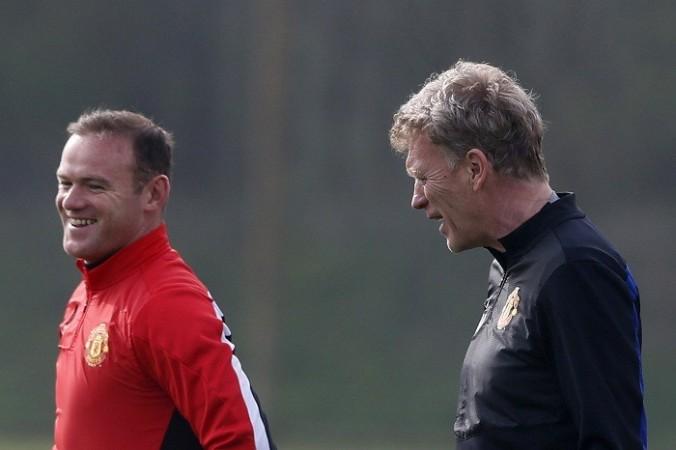 Manchester United manager David Moyes and Wayne Rooney during a training session ahead of their Champions League quarterfinal first leg against Bayern Munich, 31 March. Reuters Wayne Rooney David Moyes Manchester United