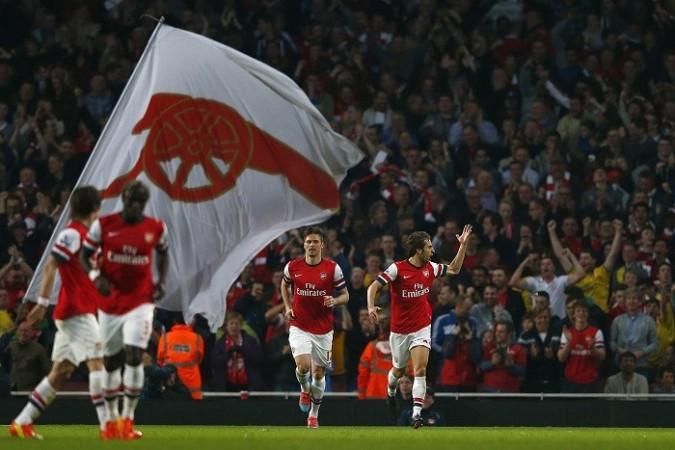 Arsenal celebrate after scoring against Manchester City in the English Premier League, 29 March. Reuters Arsenal Flamini