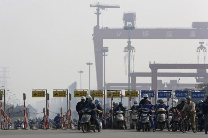 File photo people riding a motorcycle in front of the office of Ranbaxy Laboratories at Gurgaon