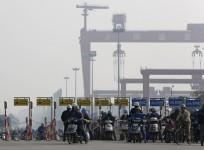 file-photo-people-riding-a-motorcycle-in-front-of-the-office-of-ranbaxy-laboratories-at-gurgaon