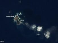 japans-volcanic-island-niijima-swallows-its-neighbor-earth-observatory-nasa