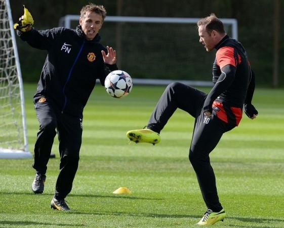 The fate of former Man United star Phil Neville (L) will be decided next week. Wayne Rooney Phil Neville Manchester United