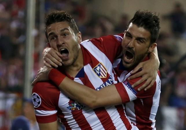 Atletico Madrid midfielder Koke celebrates with teammate David Villa after scoring against Barcelona in their Champions League quarterfinal second leg, 9 April. Reuters Koke David Villa Atletico Madrid