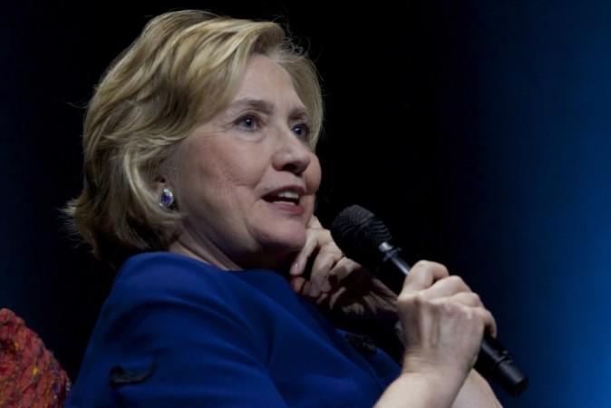 Hillary Clinton was forced to duck on Thursday when a female protester threw what was described as a shoe at her. (Reuters)