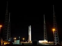 the-spacex-falcon-9-rocket-with-a-dragon-commercial-cargo-craft-on-top-rests-at-its-launch-pad-on-march-1-2013-at-the-cape-canaveral-air-force-station-in-florida-nasa-bill-ingalls
