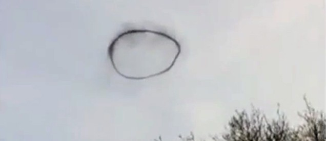 A mysterious black ring that hovered over the English Sky, has led to many people thinking what it possibly could be.  (Photo: YouTube Video Screen Grab)