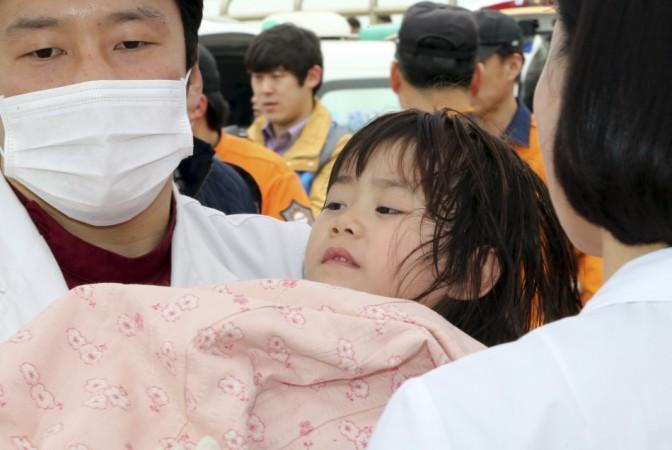 A South Korean Passenger ship carrying more than 470 people, mostly high school students has capsized. In the Picture, a girl is being rescued (Photo: Reuters) A South Korean Passenger ship carrying more than 470 people, mostly high school students has capsized. In the Picture, a girl is being rescued (Photo: Reuters)