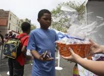 easter-2014-a-boy-receives-an-easter-basket-at-a-good-friday-easter-event-sponsored-by-the-los-angeles-mission-to-help-the-homeless-and-near-homeless-of-skid-row-in-los-angeles-california-photo-reuters