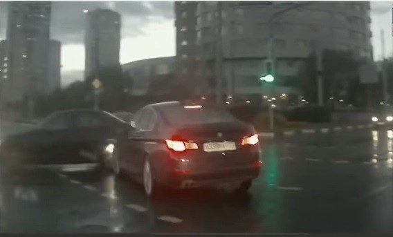 A still from a YouTube video showing a 'ghost car' appearing out of nowhere and causing a crash (Image Credit: YouTube Screenshot)