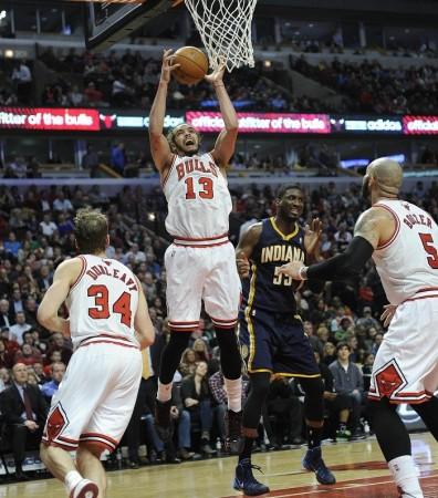 Chicago Bulls' Joakim Noah attempting a slam against Indiana Pacers in regular in-season game. Chicago Bulls