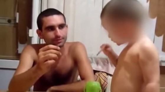 A shocking footage of a dad giving his toddler a cigarette has now gone viral, triggering a surge of outrage among internet users. (Image: YouTube screen grab)