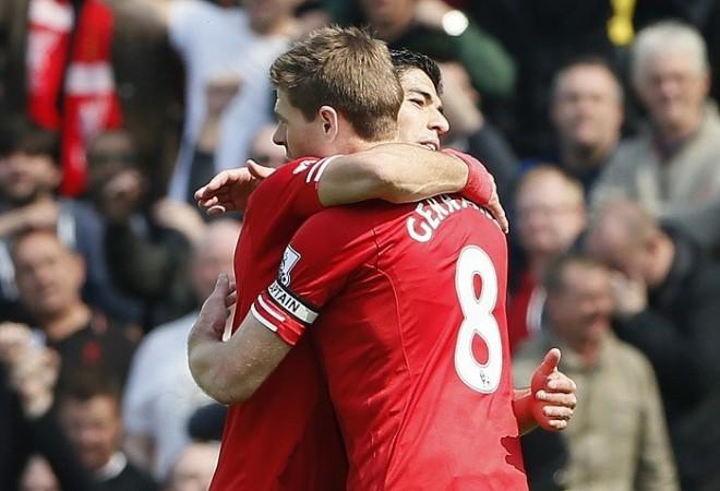 Steven Gerrard and Luis Suarez celebrate their win over Norwich in the English Premier League, 20 April. Reuters Steven Gerrard Luis Suarez Liverpool