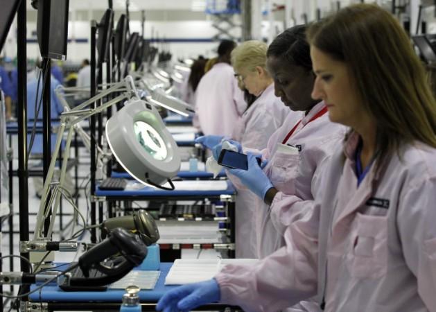 Workers assemble Motorola phones at the Flextronics plant that will be building the new Motorola smart phone Motorola Moto E Release Date in a Week? Rumoured Specifications