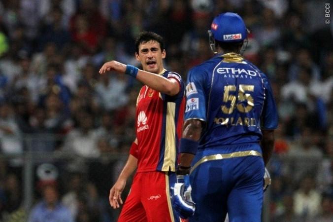 Mitchell Starc and Kieron Pollard have a go at each other in the IPL 2014 game, 7 May. Vipin Pawar/IPL/SPORTZPICS Starc Pollard RCB Mumbai Indians
