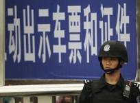 a-policeman-stands-guard-at-a-railway-station-after-a-knife-attack-in-guangzhou-guangdong-province-may-6-2014-reuters-alex-lee