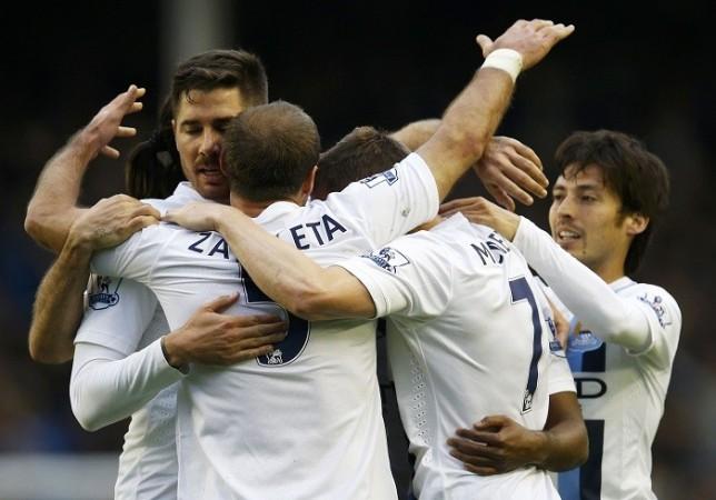 Manchester City players celebrate their win over Everton in the English Premier League, 3 May. Reuters Manchester City