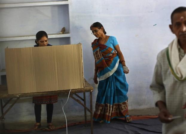 Women at a polling station in the final phase of the general election in Varanasi