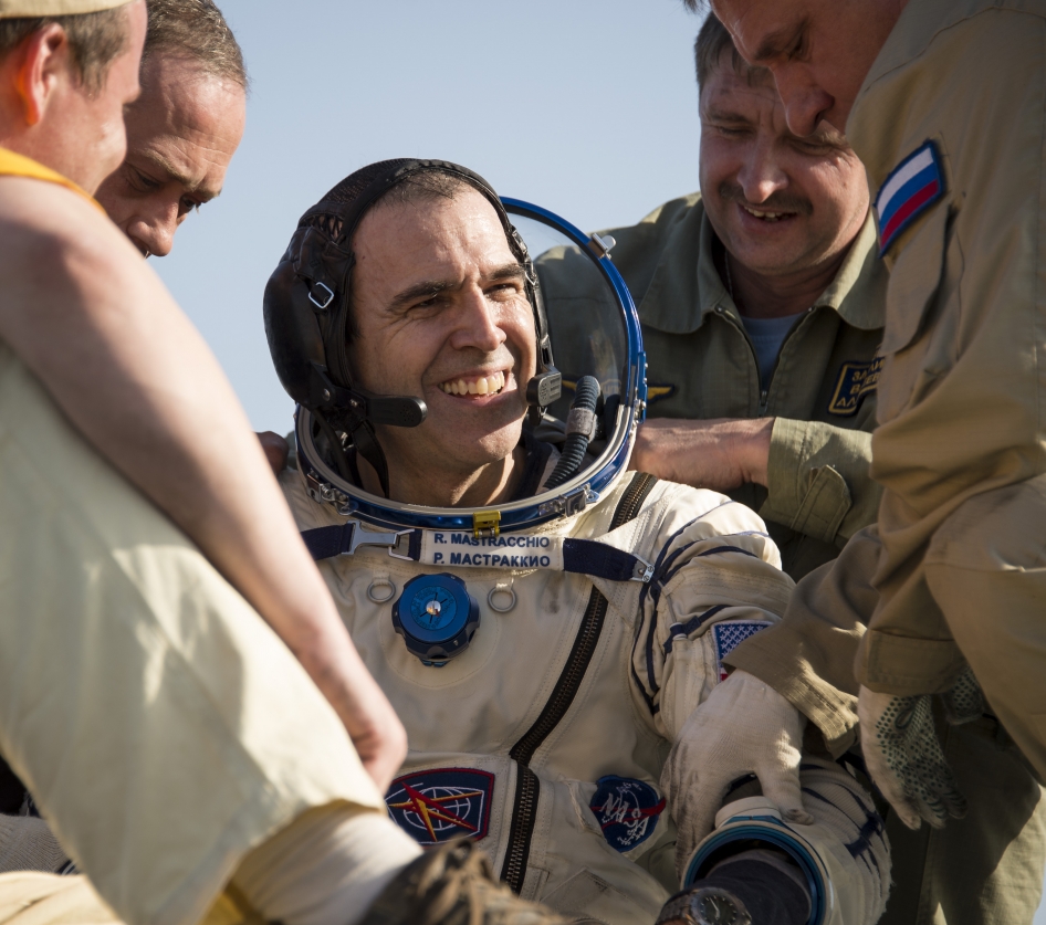 Expedition 39 Flight Engineer Rick Mastracchio of NASA is helped out of the Soyuz capsule just minutes after he and Expedition 39 Commander Koichi Wakata of the Japan Aerospace Exploration Agency (JAXA) and Soyuz Commander Mikhail Tyurin of the Russian Fe