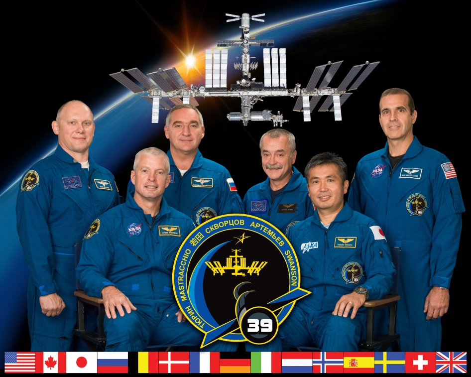 Expedition 39 crew members take a break from training at NASA's Johnson Space Center to pose for a crew portrait. Pictured on the front row are Japan Aerospace Exploration Agency (JAXA) astronaut Koichi Wakata (right), commander; and NASA astronaut Steve