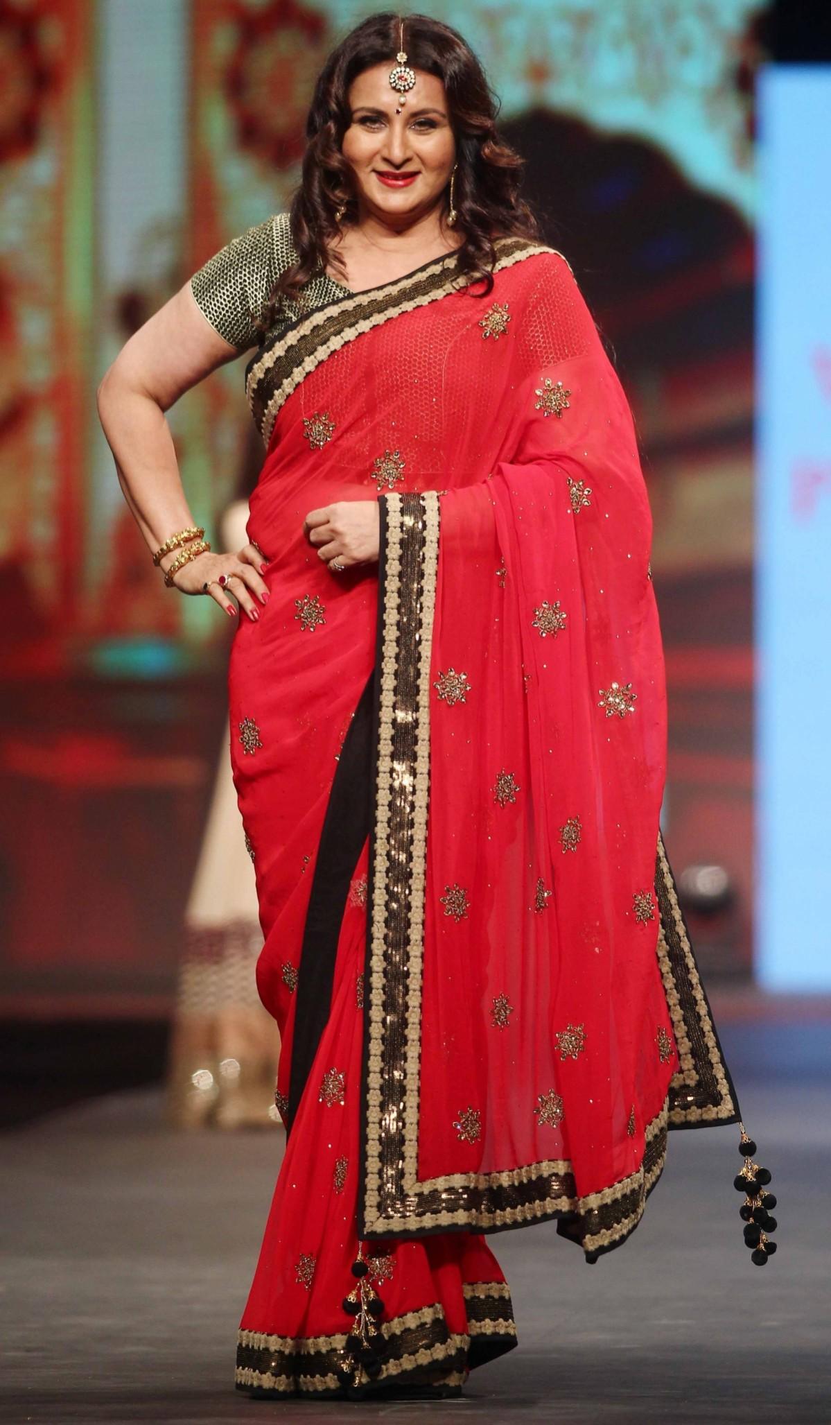 Poonam Dhillon is all smiles for the camera as she regains her posture after the fall during 'Caring with Style' fashion show. Poonam Dhillon