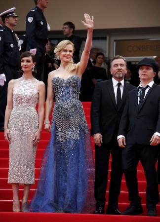 Director Olivier Dahan, cast members Paz Vega, Nicole Kidman, Tim Roth pose on the red carpet as they arrive for the opening ceremony and the screening of the film "Grace of Monaco" out of competition during the 67th Cannes Film Festival in Cannes