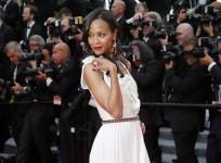 Actress Zoe Saldana poses on the red carpet as she arrives for the opening ceremony of the 67th Cannes Film Festival in Cannes