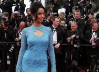 Bollywood actress Mallika Sherawat poses on the red carpet as she arrives for the opening ceremony of the 67th Cannes Film Festival in Cannes