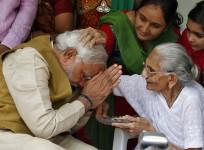Hindu nationalist Modi, prime ministerial candidate for India's main opposition BJP, seeks blessings from his mother Heeraben at her residence in Gandhinagar
