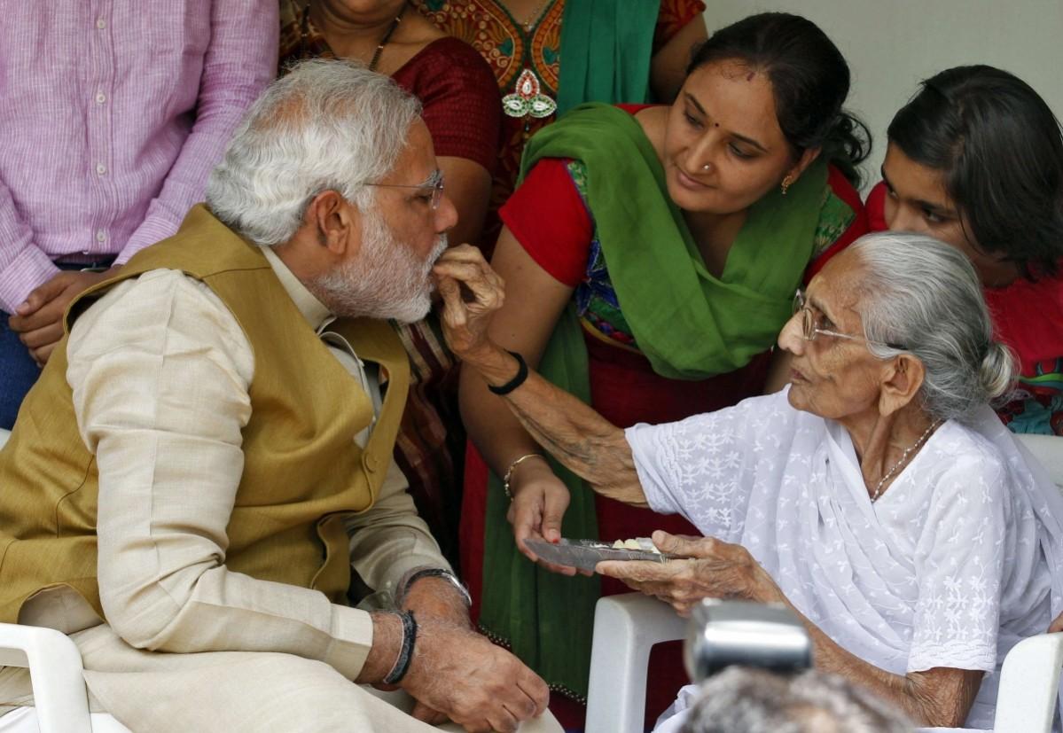 Hindu nationalist Modi, prime ministerial candidate for India's main opposition BJP, seeks blessings from his mother Heeraben at her residence in Gandhinagar Hindu nationalist Modi, prime ministerial candidate for India's main opposition BJP, seeks blessings from his mother Heeraben at her residence in Gandhinagar