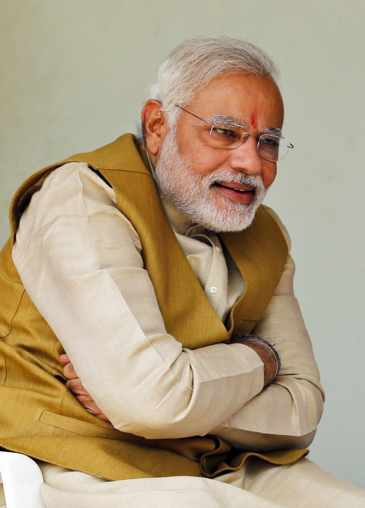 Hindu nationalist Modi, prime ministerial candidate for India's main opposition BJP, smiles as he speaks with his mother Heeraben after seeking blessings from her at her residence in Gandhinagar Hindu nationalist Modi, prime ministerial candidate for India's main opposition BJP, smiles as he speaks with his mother Heeraben after seeking blessings from her at her residence in Gandhinagar