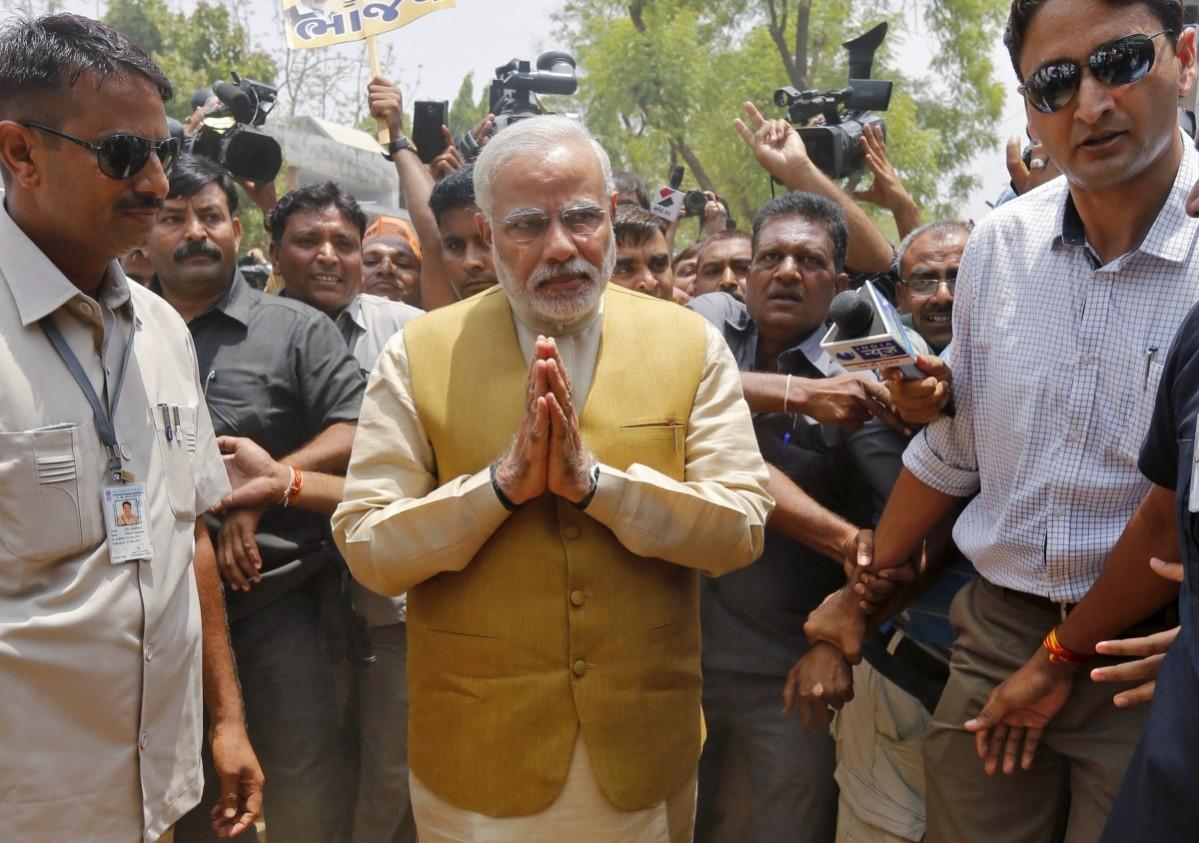 Hindu nationalist Modi, prime ministerial candidate for India's main opposition BJP, gestures as he arrives to seek blessings from his mother Heeraben at her residence in Gandhinagar Hindu nationalist Modi, prime ministerial candidate for India's main opposition BJP, gestures as he arrives to seek blessings from his mother Heeraben at her residence in Gandhinagar