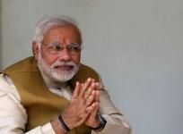 Hindu nationalist Narendra Modi, the prime ministerial candidate for Bharatiya Janata Party, gestures after seeking blessings from his mother Heeraben in Gandhinagar