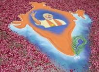 A rangoli showing a map of India with an image of Modi, prime ministerial candidate for BJP, is pictured in the premises of the party's regional office in the western Indian city of Ahmedabad