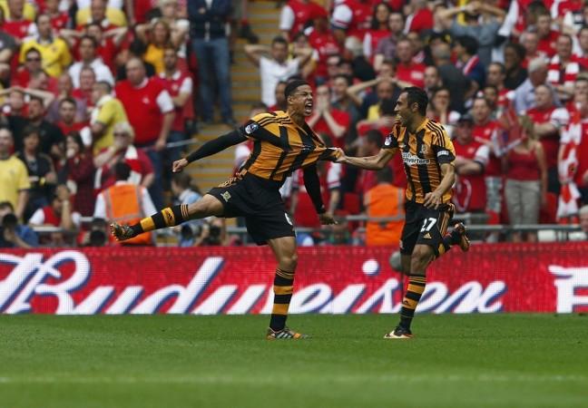 Hull City's Curtis Davies celebrates with teammate George Boyd after scoring his team's second goal against Arsenal. Curtis Davies
