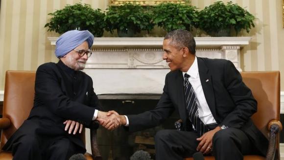 U.S. President Barack Obama shakes hands with Manmohan Singh in the Oval Office of the White House in Washington (Reuters file)