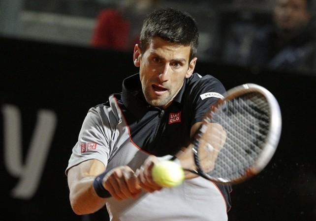 Novak Djokovic of Serbia hits a return. Novak Djokovic