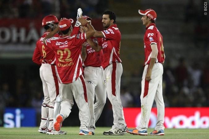 Kings XI bowler Rishi Dhawan celebrates with teammates after dismissing Rajasthan Royals opener Ajinkya Rahane in their IPL 2014 match, 23 May Rishi Dhawan Rajasthan Royals